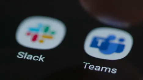 Close Up Shot of Finger Tapping the Microsoft Teams App On a Smartphone