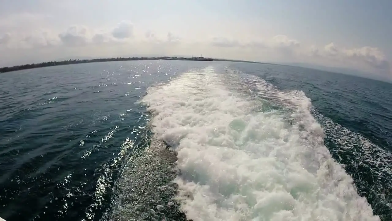 Wake created by ferry boat that has left port Hilongos Leyte Philippines