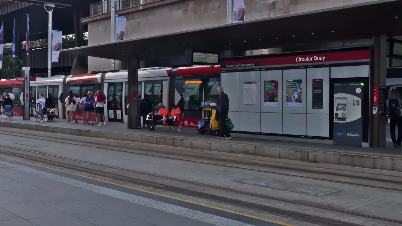 Busy Sydneysiders and visitors on a typical day at Circular Quay station of Sydney's light rail or tram system