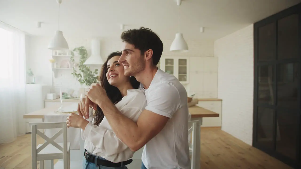 Portrait of happy couple planning interior design in slow motion