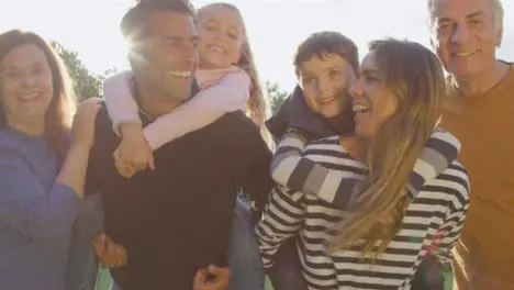 Low Angle Shot of Children Piggy Backing On Their Parents 04