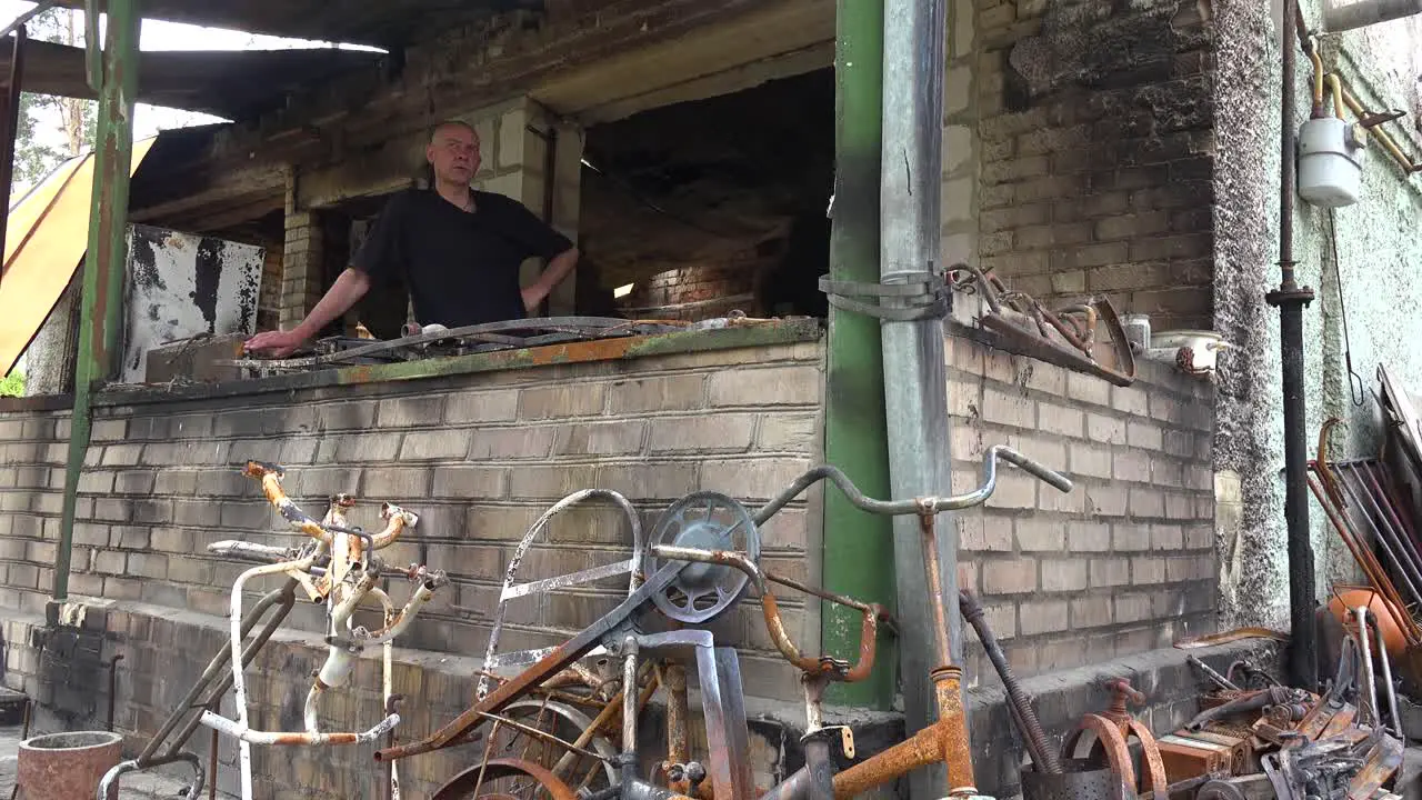 A Man Stands In The Burned Out And Destroyed Remains Of His Home After Russian Shelling In Irpin Ukraine