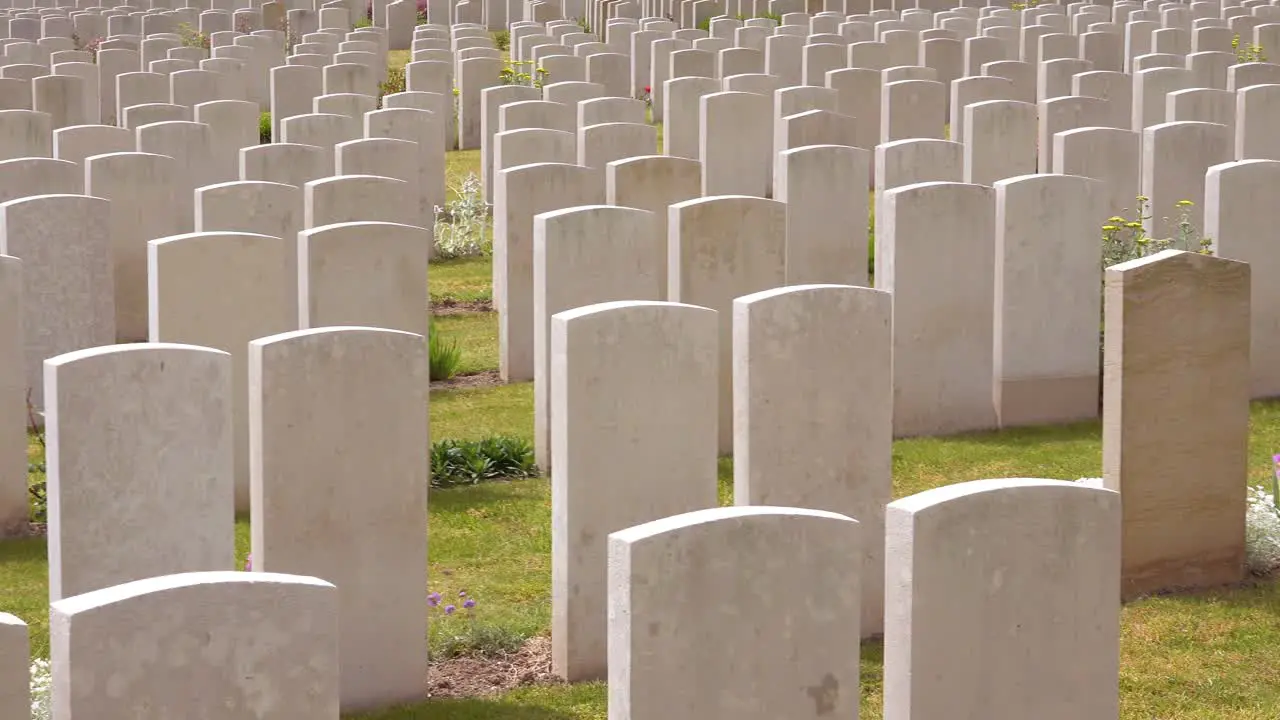 Establishing shot headstones of the Etaples France World War cemetery military graveyard and headstones of soldiers