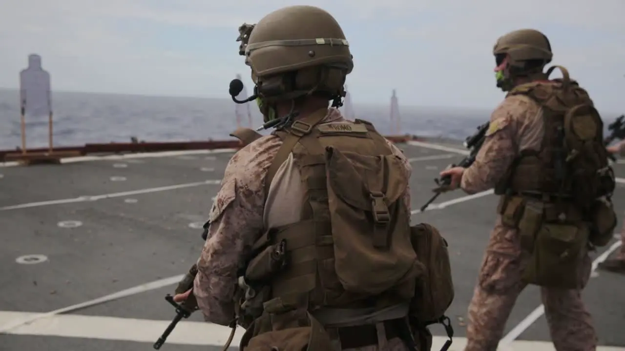 Us Marines Deployed Aboard the Amphibious Dock Landing Ship Uss Comstock Conduct A Livefire Range Exercise 2