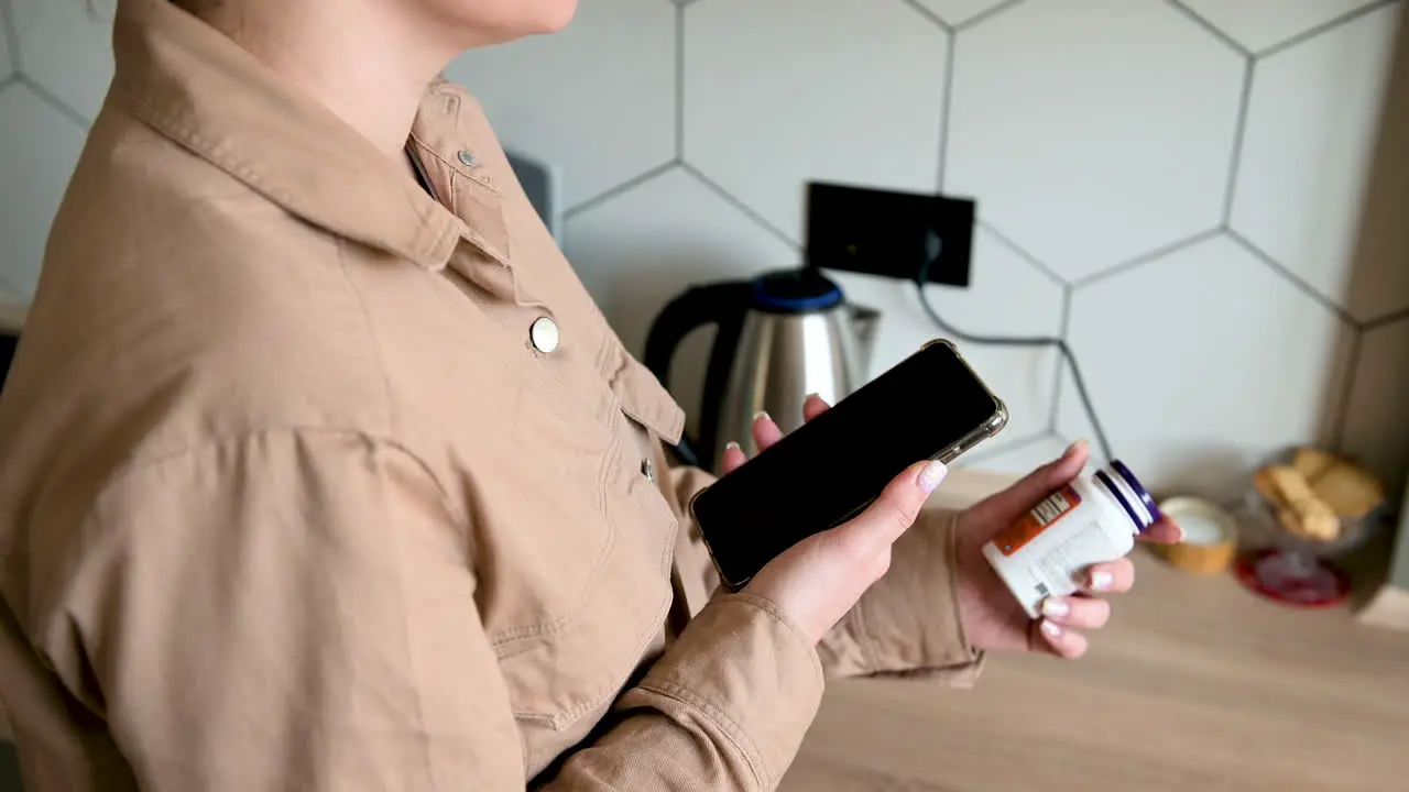 Blind Woman Using Mobile App To Read Product Label At Home