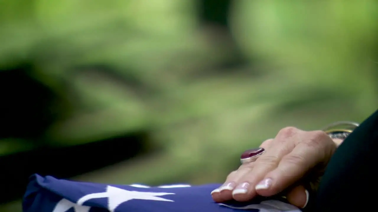 VETERAN FLAG COIN HAND OFF DURING FUNERAL