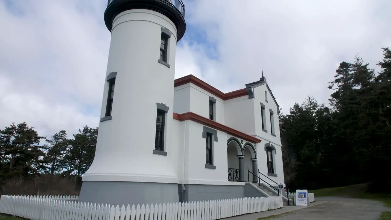 Slow motion tilt down of a restored lighthouse at Fort Casey in Washington State