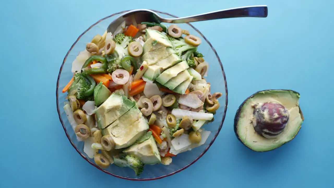 Top view of avocado salad in a bowl