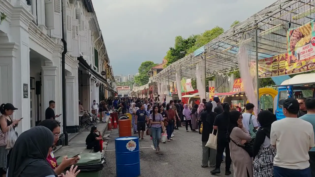 Crowd Of People And Food Stalls In The Daylight At The Ramadan Bazaar 2023 Along Arab Street 2023