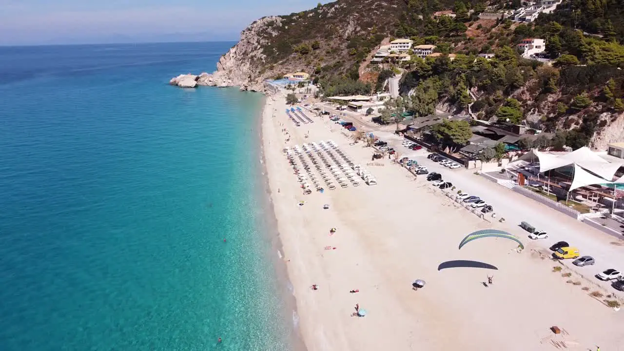 Tourist Parasailing at Kathisma Beach Lefkada Island Greece Reversing Aerial