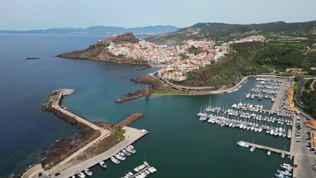 Castelsardo port and fortified town in Sardinia Italy 4k Drone Aerial Circling