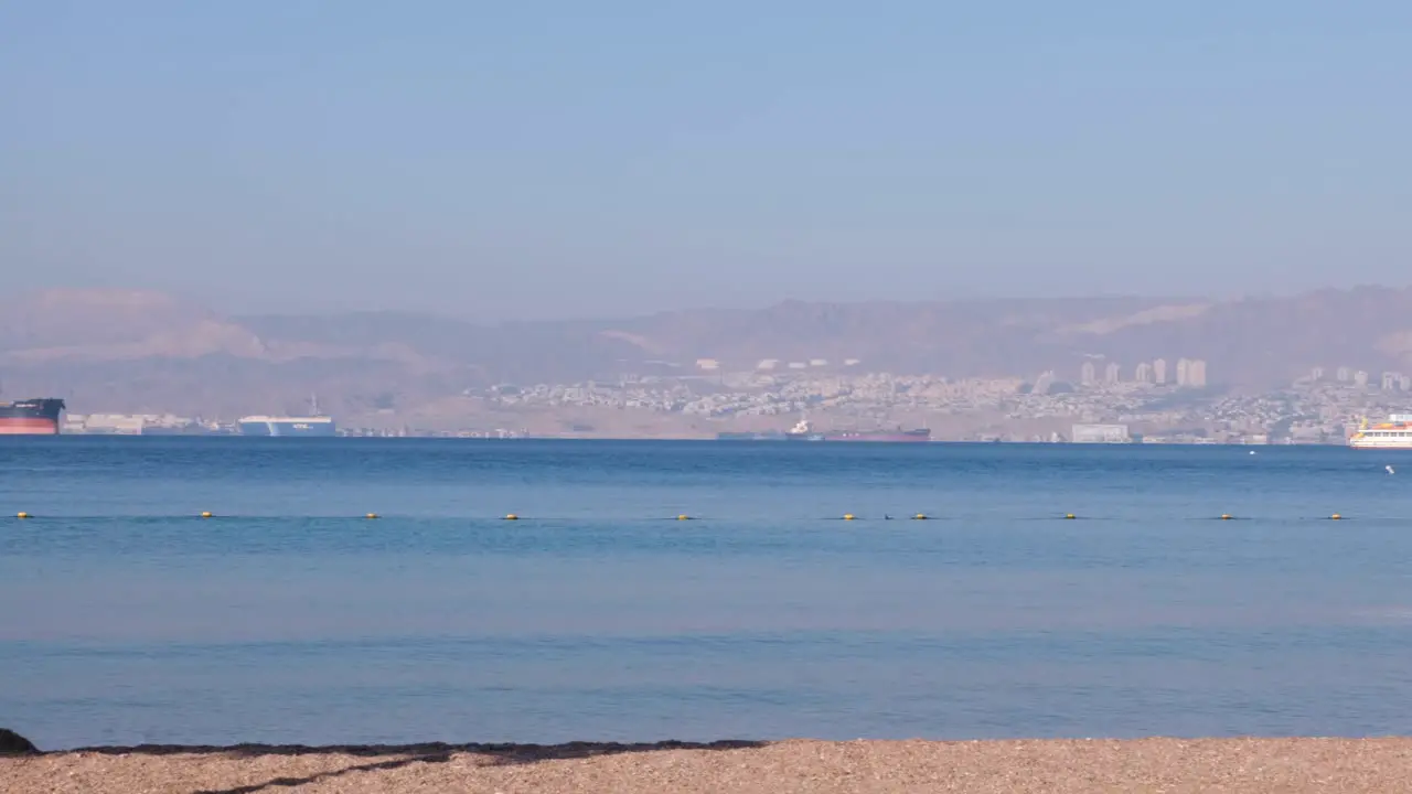 Panoramic view of Eilat City in Israel busy port and vacation resort on the Red Sea as seen from Aqaba in Jordan Middle East