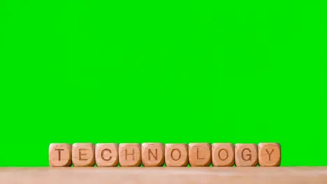 Business Concept Wooden Letter Cubes Or Dice Spelling Technology Against Green Screen