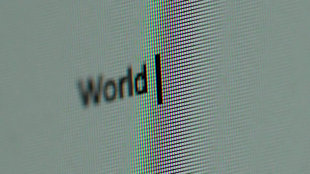 World War III being typed on screen extreme close up macro letters text warning news