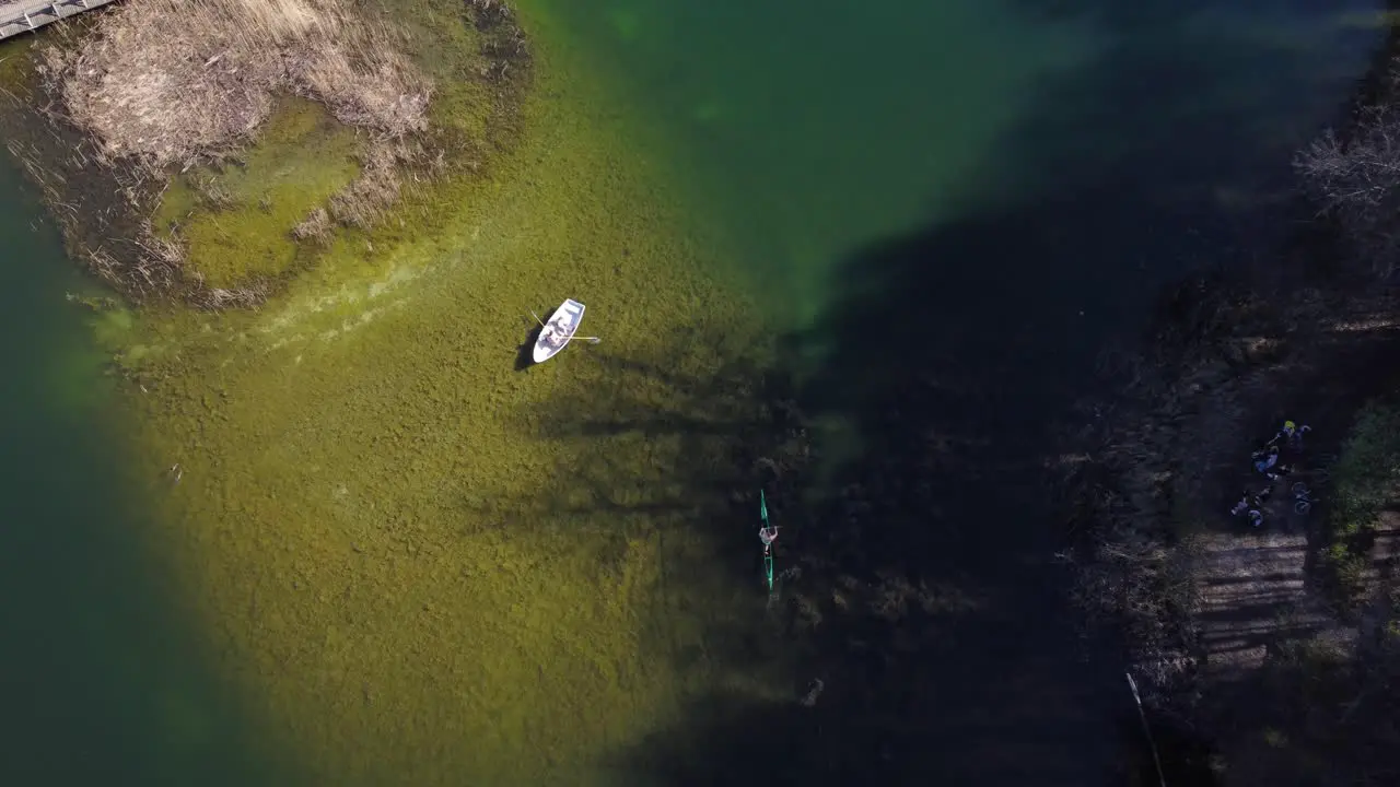 AERIAL Boat and Kayak in a Blue Lake in Vilnius Lithuania