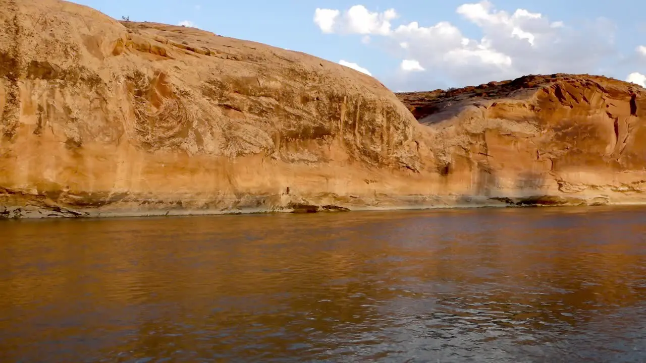 Pan of canyon wall and river in Utah