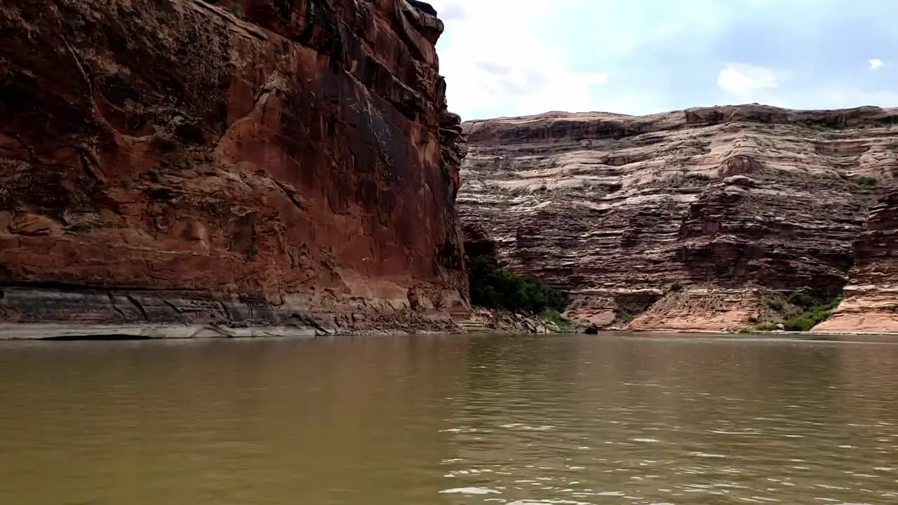 Pan of canyon from river in Utah