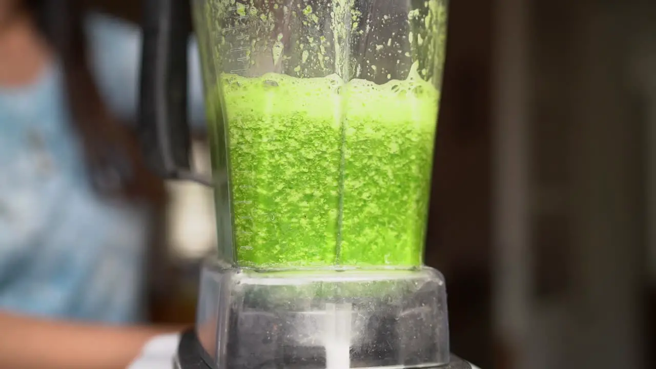 Blending Green Vegetable Juice With Blender Until Smooth