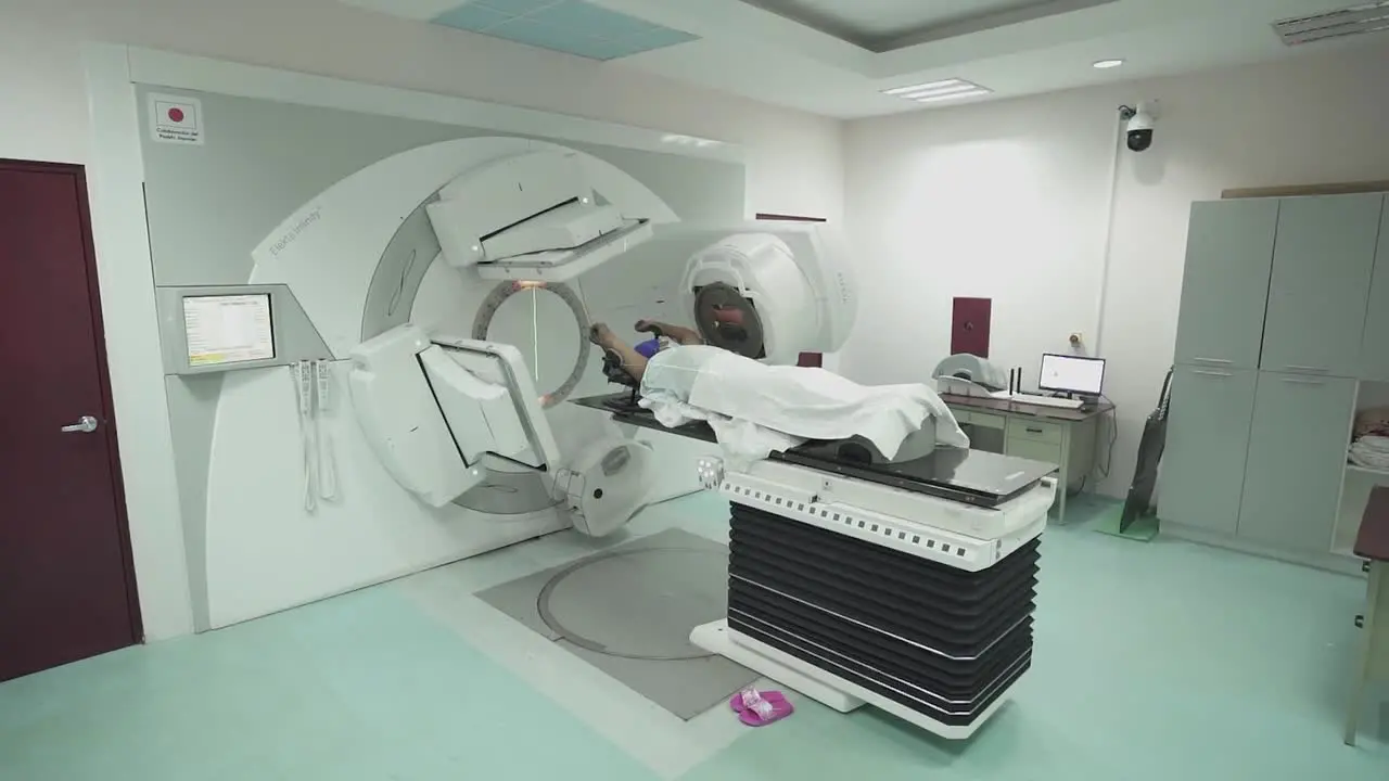 Human receiving intensity modulated radiation therapy