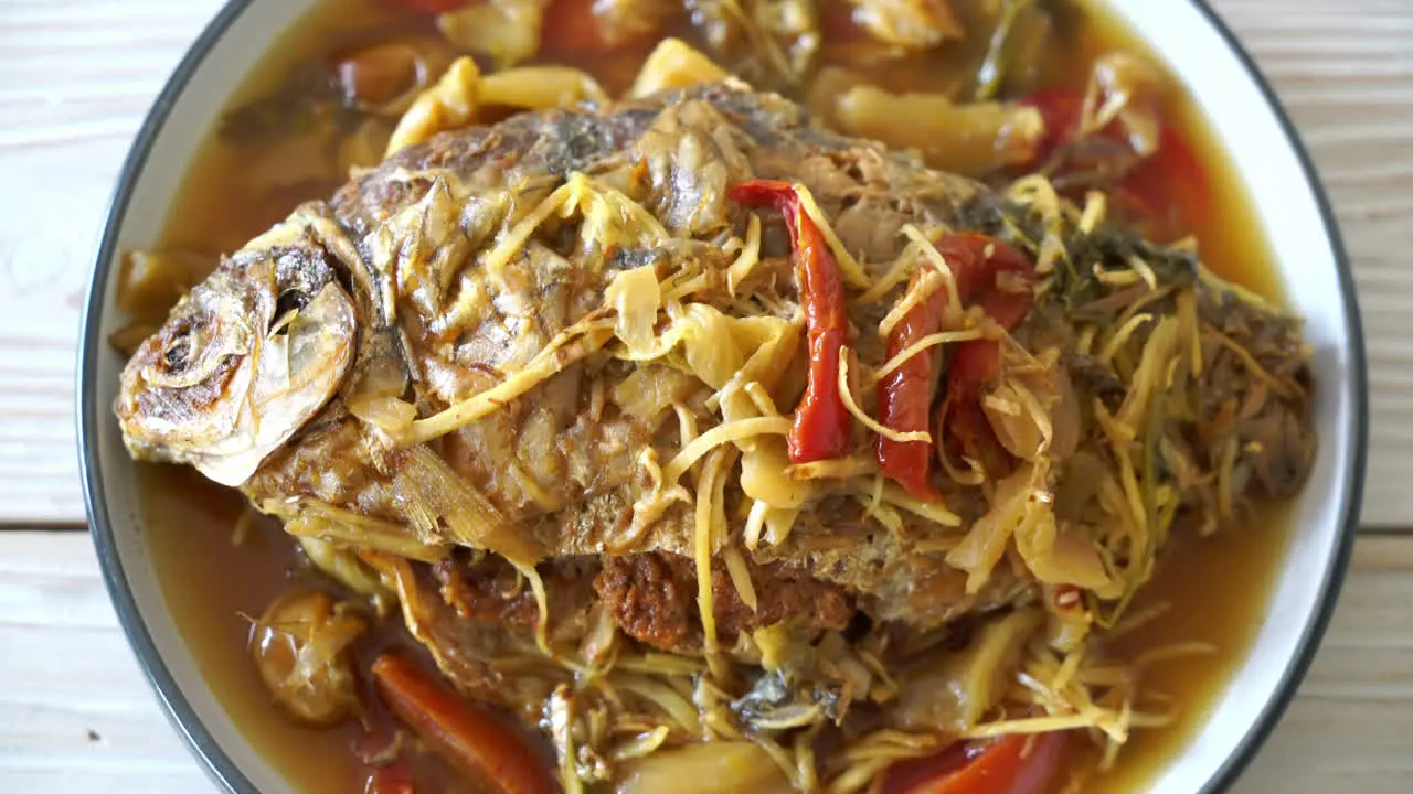 Boiled Carp fish with pickled lettuce