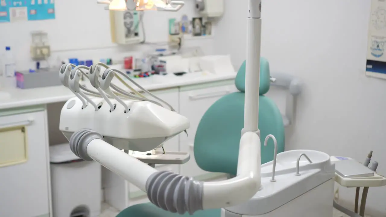 Side view of a modest dental clinic without people showing the dentist's equipment necessary to treat oral ailments