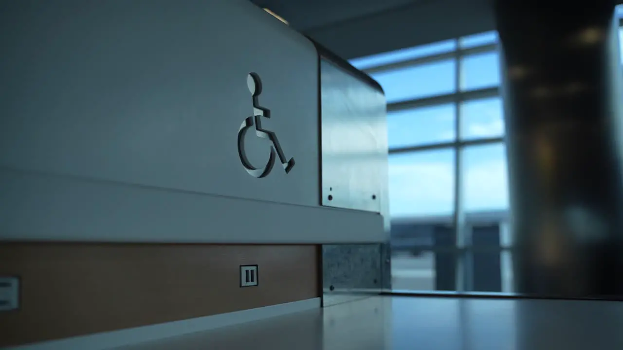 handicap sign in sitting area at airport