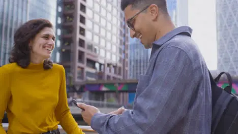 Tracking Shot of Friends Taking Selfie In City