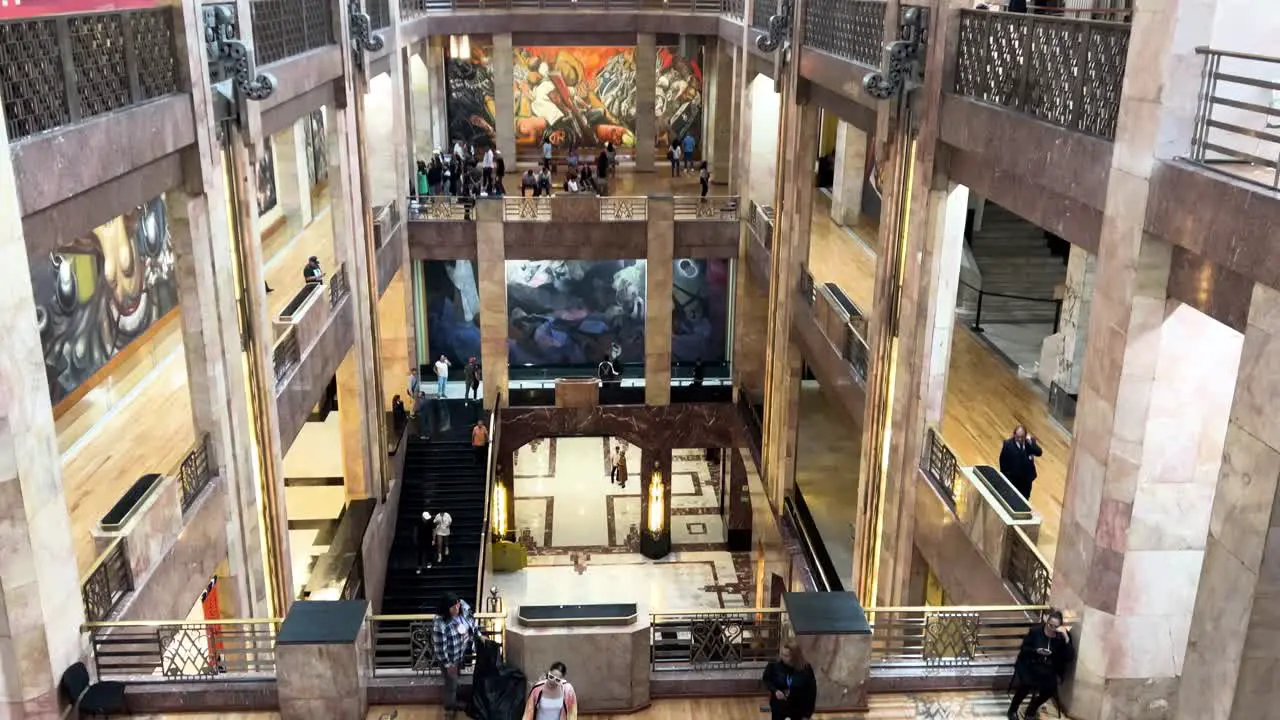 slow motion shot of people enjoying art exhibition at palacio de bellas artes in mexico city