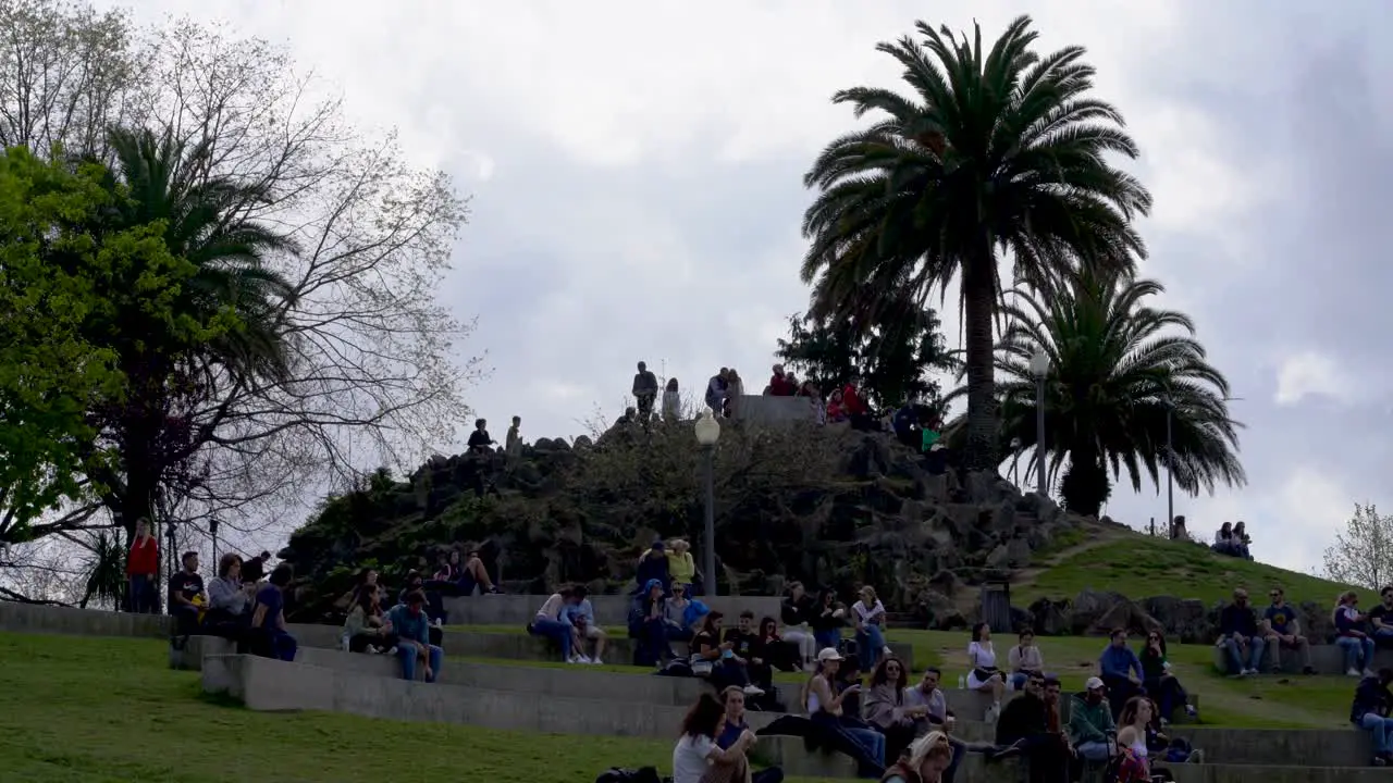 Tourists waiting for sunset at Jardin do Morro overlooking Rio Douro and Riberia do Porto