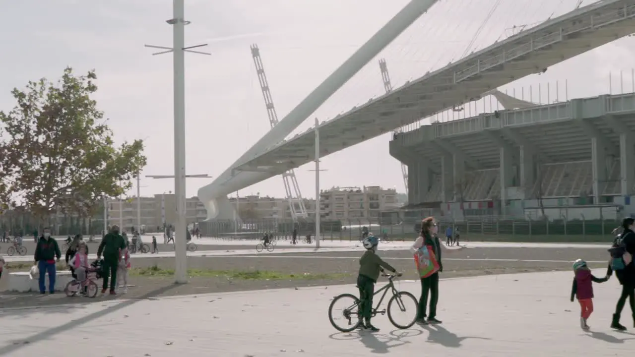 Pan wide shot of people having fun at Athens Olympic Complex park on Christmas Day during coronavirus restrictions