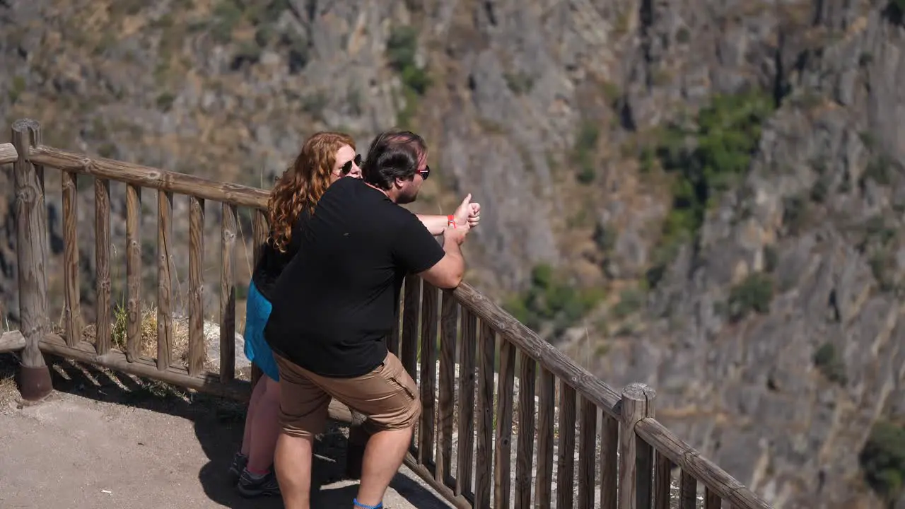 Couple relish in the view of the Ribeira Sacra in Spain still shot