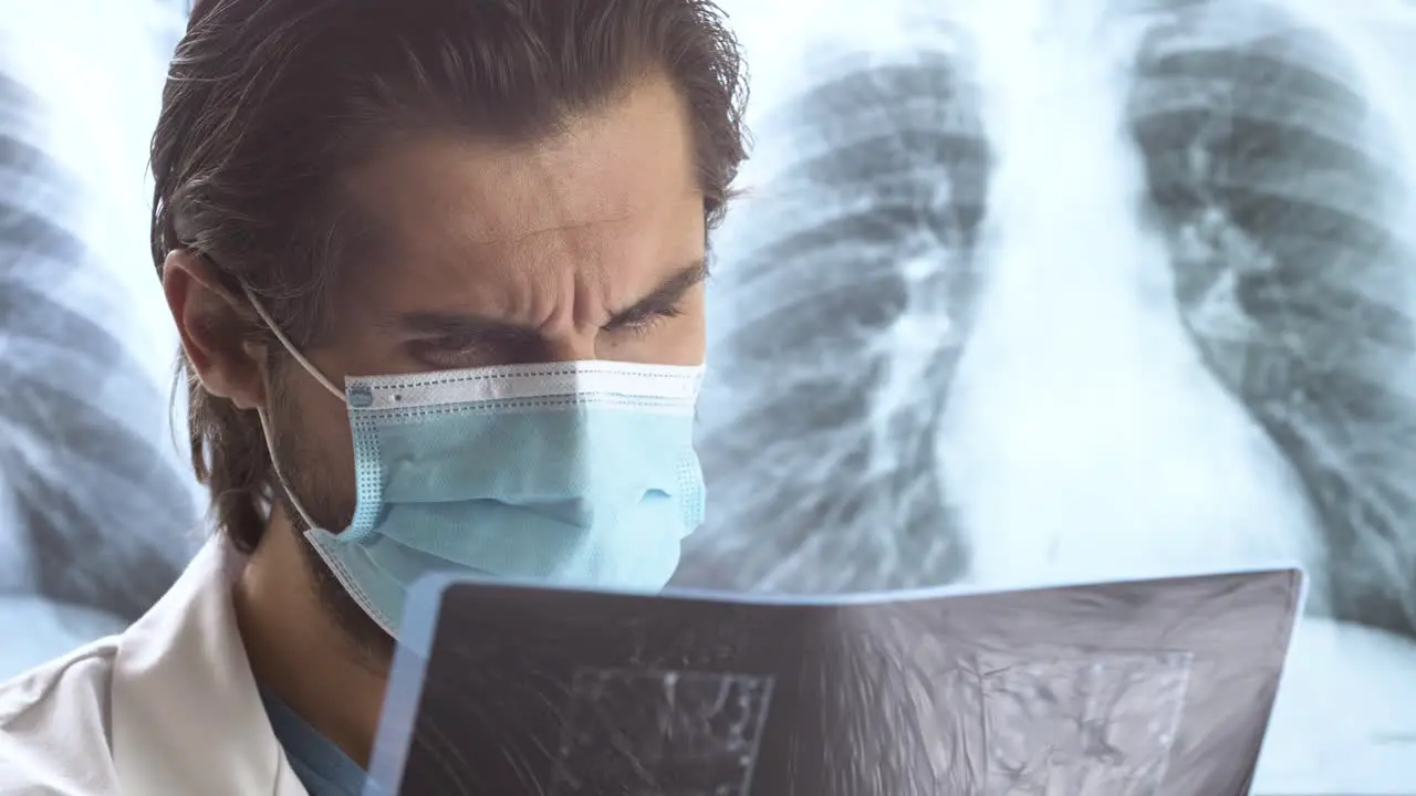 Senior doctor checking an X-ray scan to diagnose medical condition