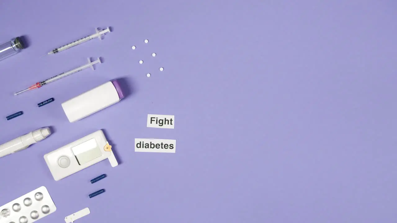 hand placing a fight diabetes label by insulin injection kit