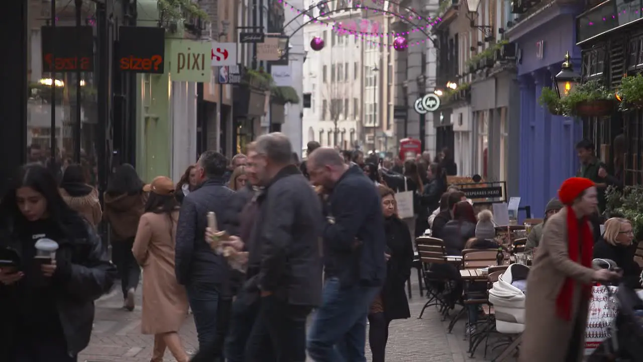 Busy crowds of people in London Carnaby street