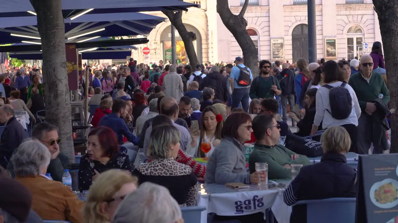 Esplanade cafes full of people during the 25 of April celebrations in Lisbon