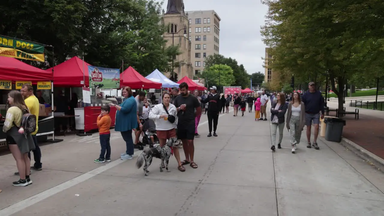 People walking at Taste of Madison event in Madison Wisconsin with gimbal video walking forward