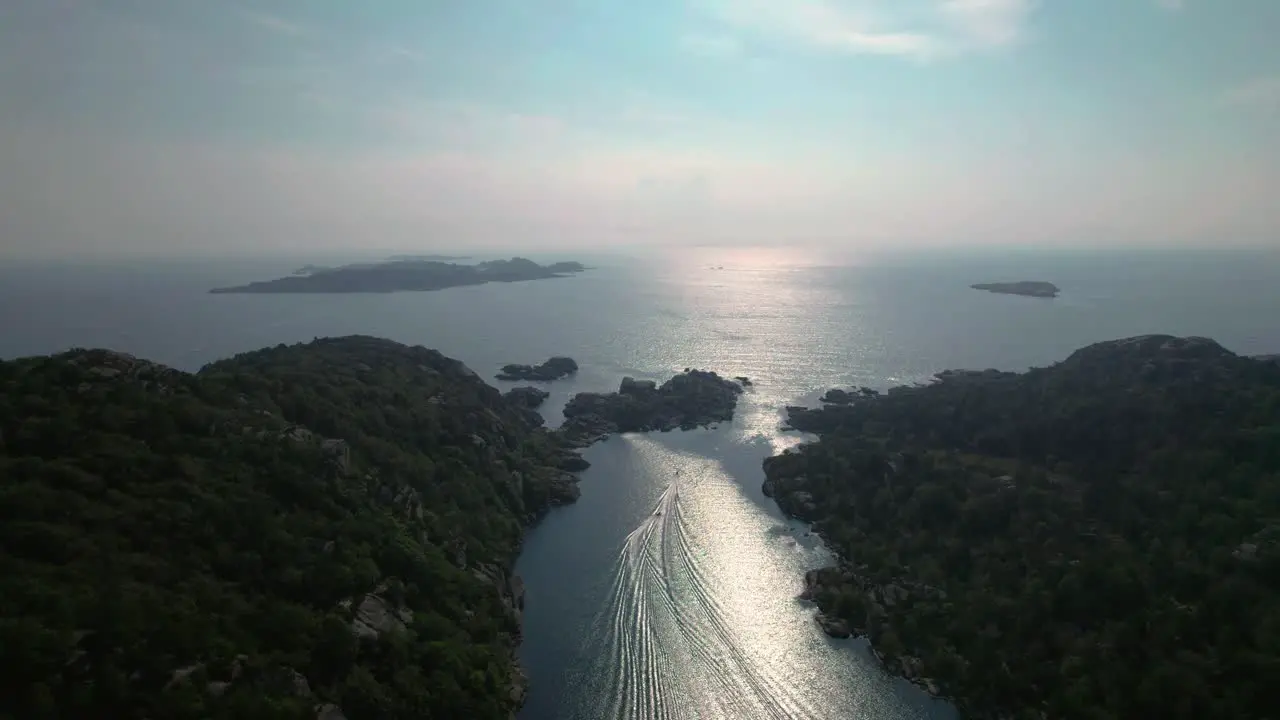 Drone footage of two boats racing in a gap between two islands south of Norway