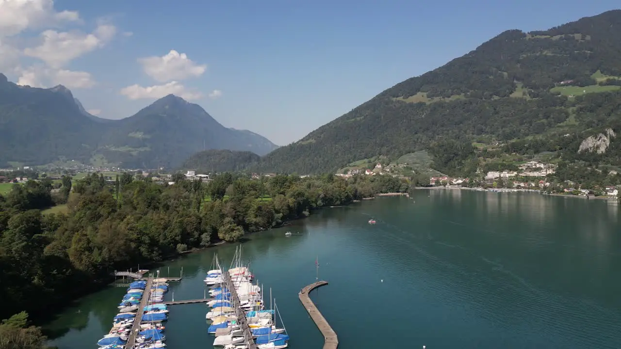 Aerial view of beautiful lakes in Europe along with water sports and fishing boats docked at the shore