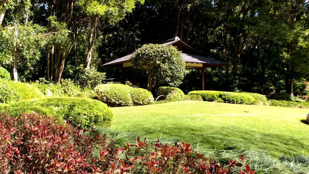 Small hut sitting amongst the flowers Japanese Gardens Brisbane Queensland