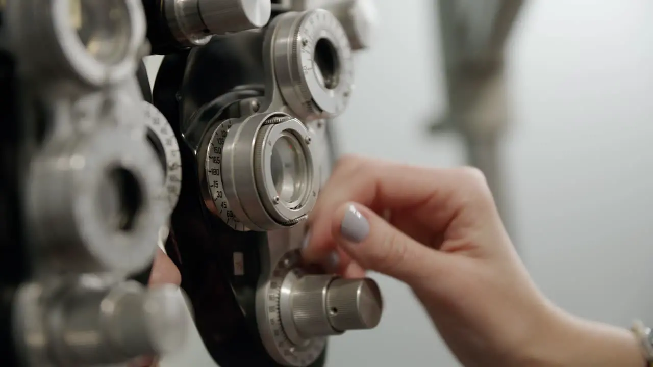 Patient getting an eye exam with an optometrist in an eye clinic using a phoropter