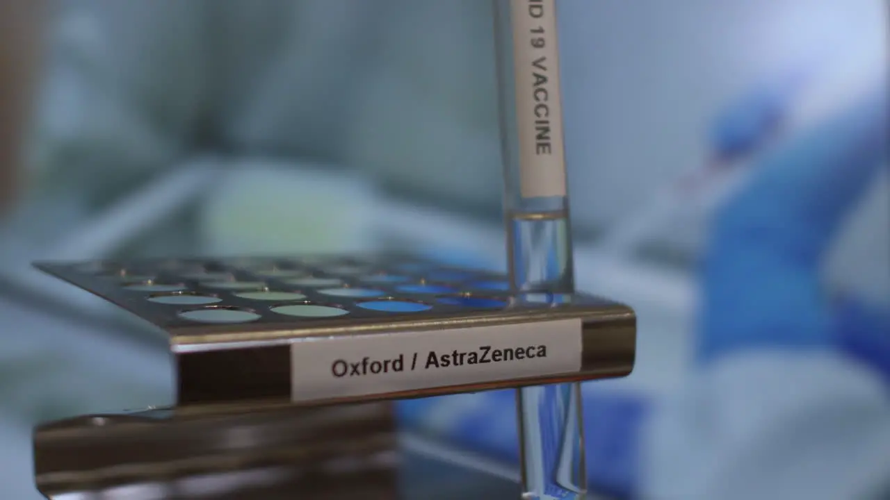 Covid 19 Oxford AstraZeneca Vaccine Test Tube Vials Being Placed Into Rack