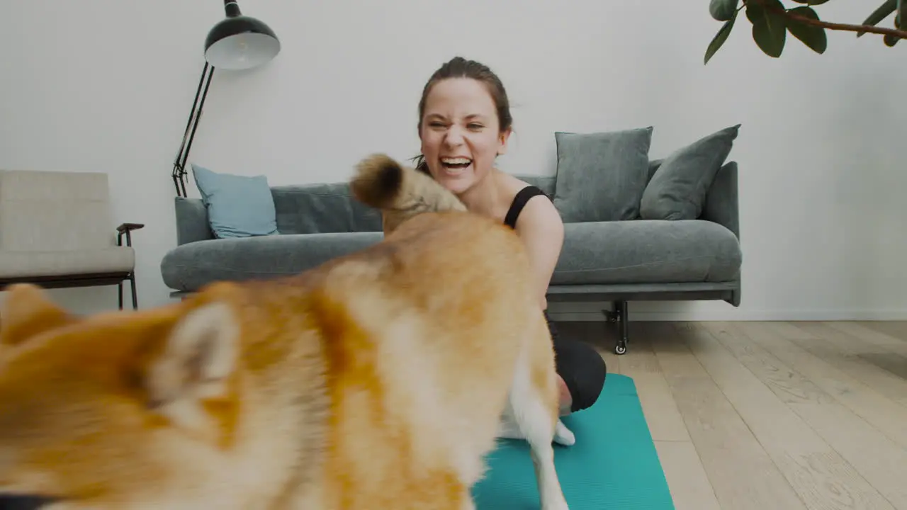 A Girl Takes A Break From Her Yoga Session To Play With Her Cute Dog 2