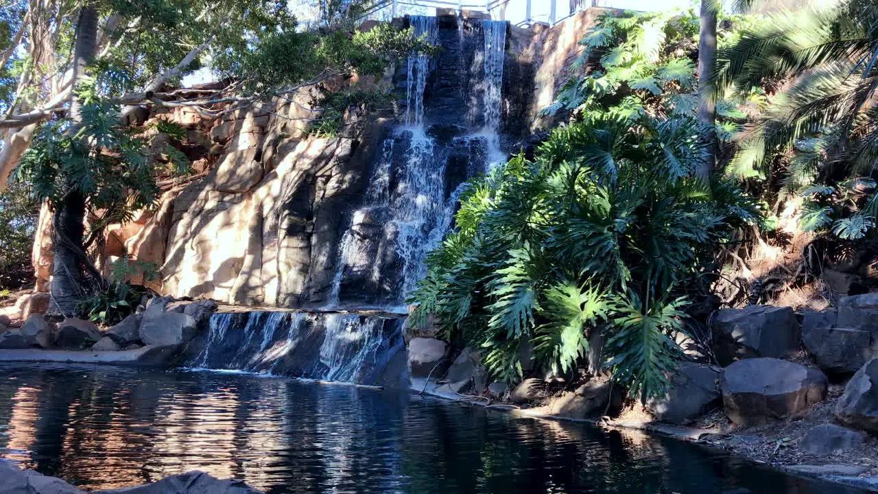 Waterfall flowing into peaceful green pond Toowoomba Queensland