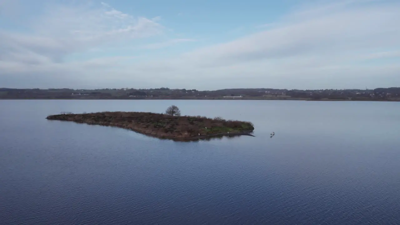 Aerial View of Small Island in a Lake Winter Landscape Truck Shot