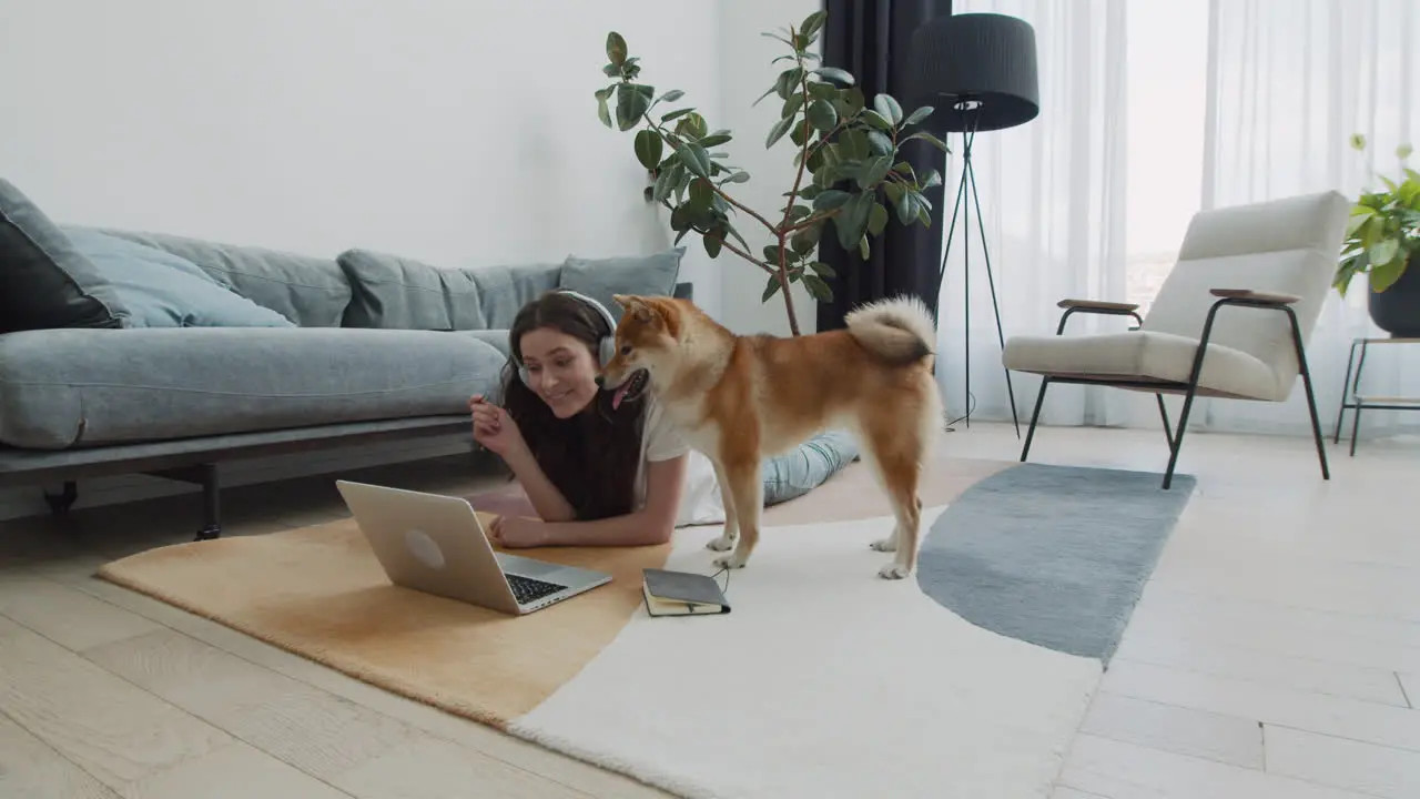 Cute Young Female Makes A Video Call With Her Dog At Home