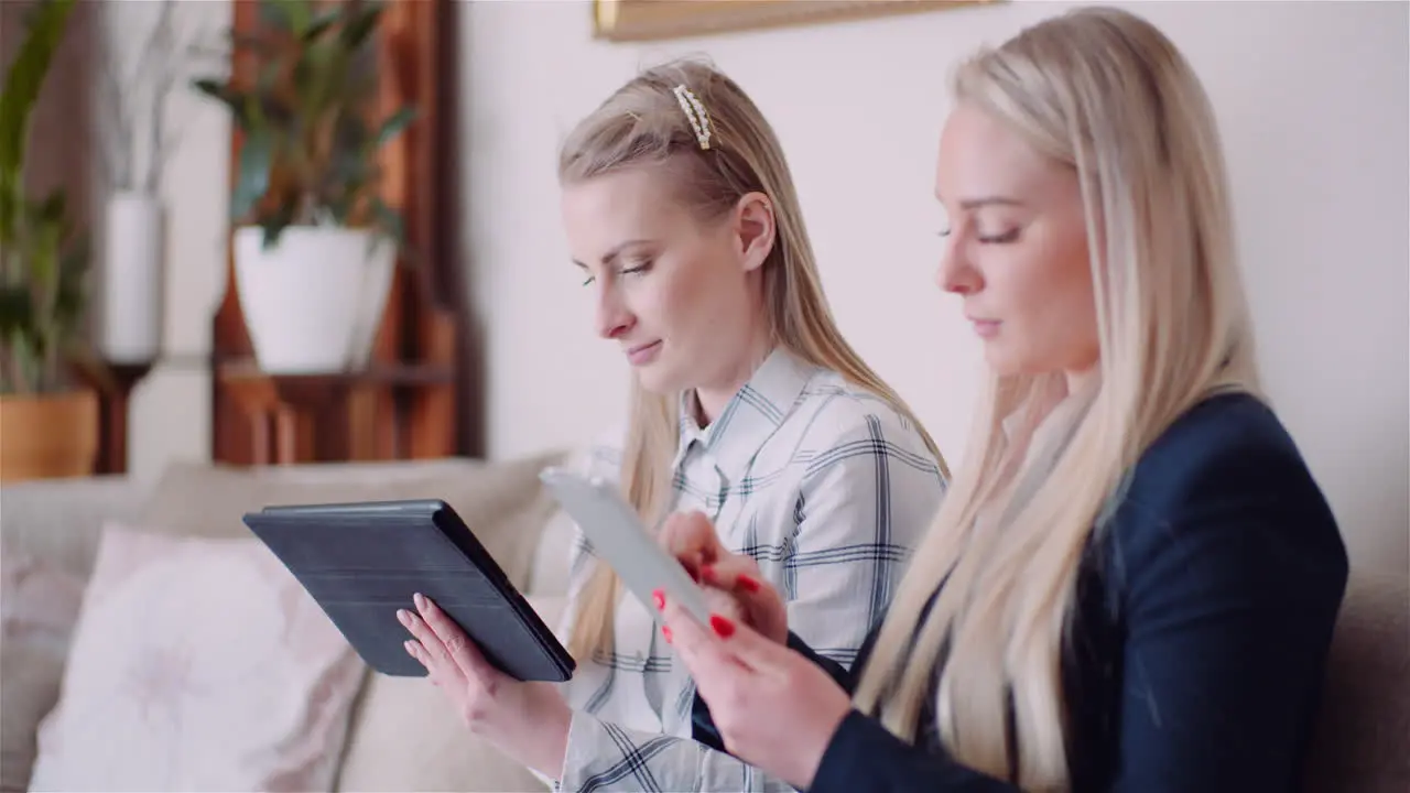 Businesswomen Discussing Over Technologies In Office Businesswomen Working On Digital Tablet 1