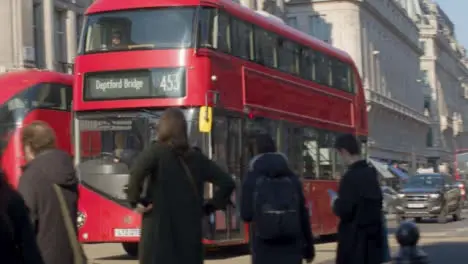 Pedestrians And Traffic At London Crossroads And Subway Entrance