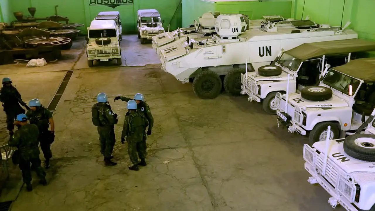 United nations armored vehicle base with transport units and troops