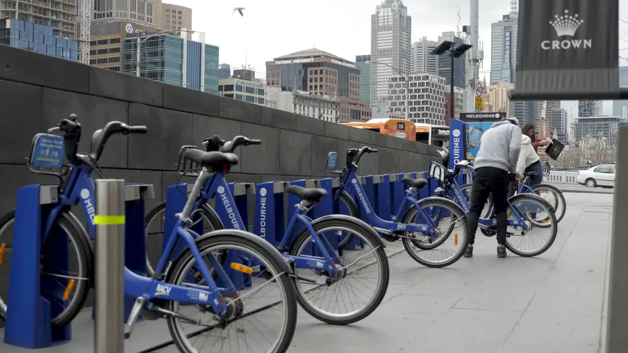 people unlocking bike in melbourne cbd