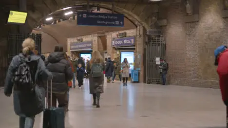 Busy Entrance To London Bridge Rail Station London UK With Commuters At Night